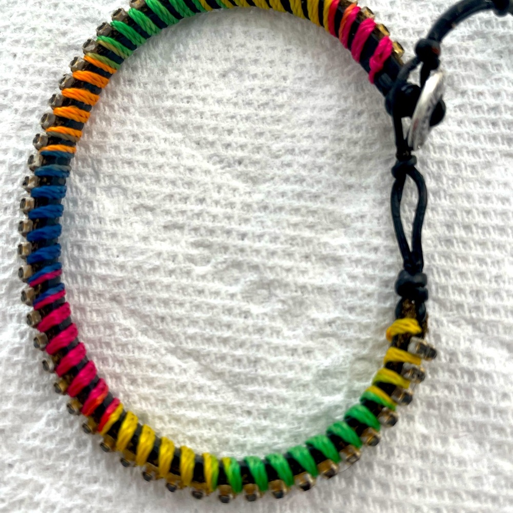 Stella&Dot Bracelet - 3 rows of shiny beads anchored by multi-colored thread.